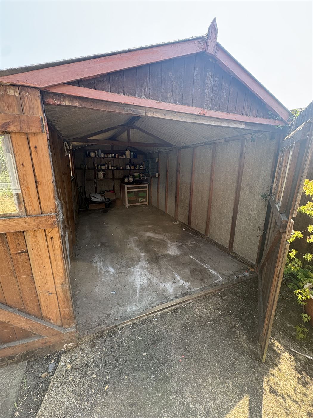 The same shed cleared and swept, empty and ready to use again