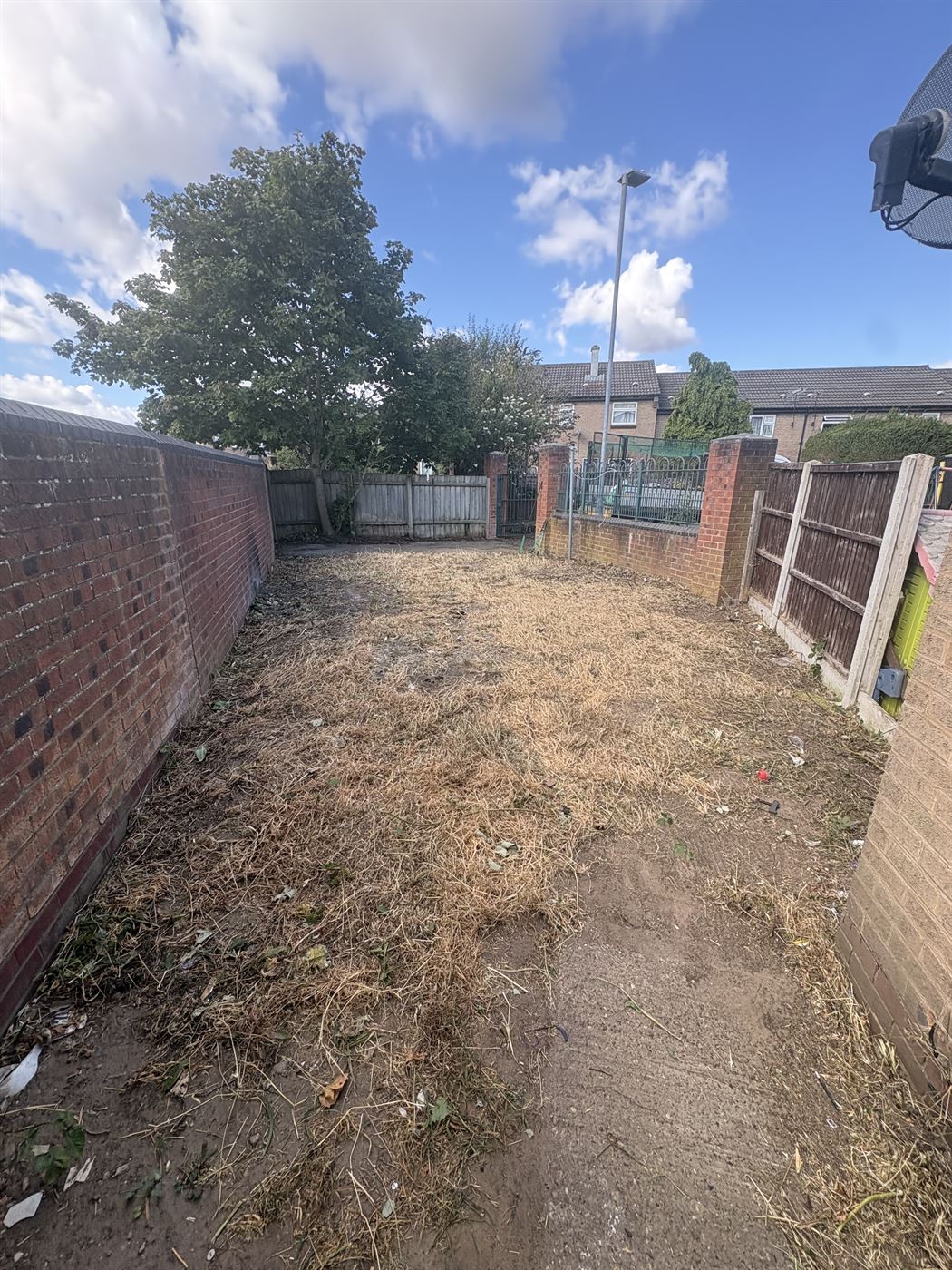 The same garden cut back to bare ground and swept